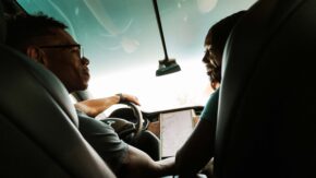 couple talking while driving electric vehicle