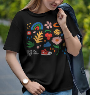 a woman wearing a black t-shirt with illustrations in the parks colors