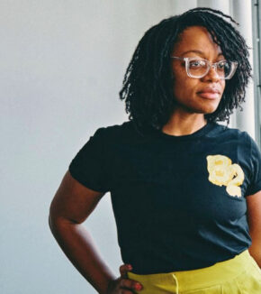 a woman wearing a butter t-shirt