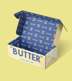 an open box designed like a stick of butter with a step-and-repeat pattern of butter graphics on the inside