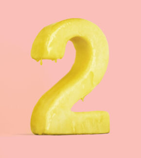 butter sculpted into the shape of a 2 and slightly melted